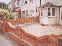Thumbnail of the process of a block paved front, new wall and block paving to rear garden.