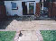 Thumbnail of the process of a patio rear garden with patio steps leading to grass area.