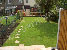 Thumbnail of the process of a block paved driveway, patio rear garden, brick front garden wall with flower bed.